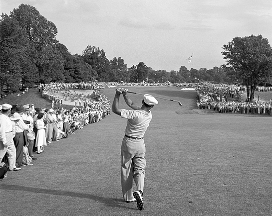 The most famous photo in golf history: Ben Hogan hits a 1 iron toward the green on the 18th hole of the 1950 US Open at Merion.